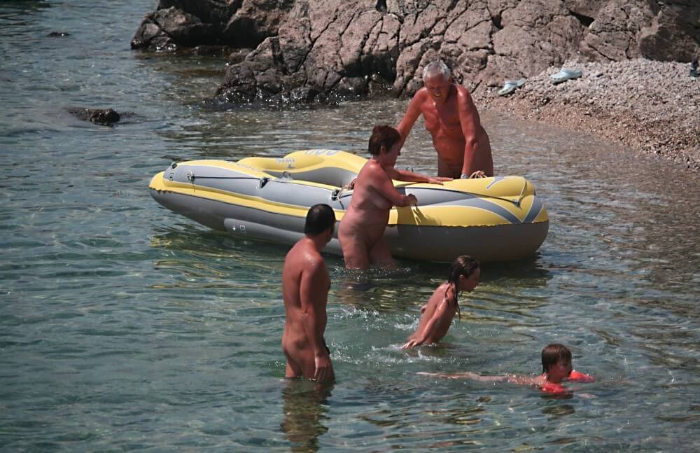Lone Nudist in Yellow Boat photos - Core values of nudist clubs