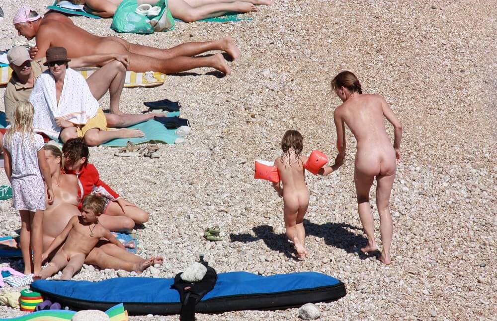 Orange Floaty Safety First Naturist pics - Spectators are permitted to be naked