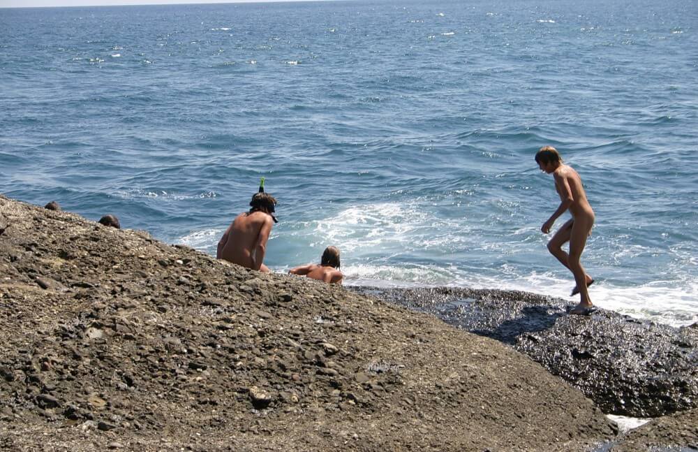 Leaning Against Hit Rocks pics - Love for oneself and nature is the foundation of the naturist and nudist lifestyle