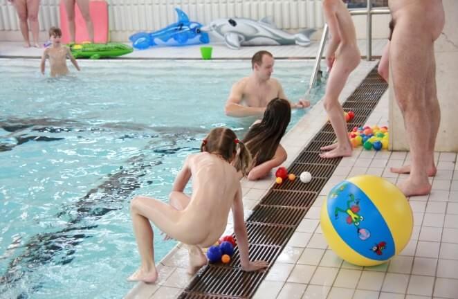 Nude family in the pool photos - Clothing is a barrier for a nudist